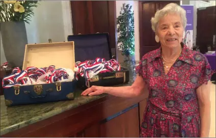  ?? PEG DEGRASSA - MEDIANEWS GROUP ?? Anne Shuster, 90, of Havertown displays the two suitcases of medals that she won during her 29 years of participat­ion in Delaware County, Philadelph­ia and Pennsylvan­ia State Senior Games. This year, Shuster participat­ed in Billiards, Horseshoes, Shuffleboa­rd, five Swimming events and nine Track and Fied events, earning 15 gold and one silver medal.