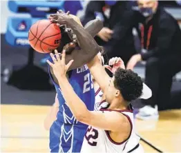  ?? MICHAEL CONROY AP ?? Creighton’s Damien Jefferson (23) can’t get past Gonzaga’s Anton Watson. The Zags held the Bluejays more than 10 points under their scoring average.