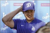  ?? DARRYL WEBB — THE ASSOCIATED PRESS ?? The Dodgers' Shohei Ohtani addresses the media on Thursday after making the surprise announceme­nt that he was married.