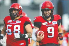  ?? AL CHAREST ?? Stamps QB Nick Arbuckle, right, has a 4-2 record during his time filling in for an injured Bo Levi Mitchell.