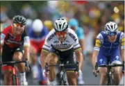  ?? PETER DEJONG - THE ASSOCIATED PRESS ?? Peter Sagan of Slovakia, center, crosses the finish line ahead of Ireland’s Daniel Martin, right, and Belgium’s Greg van Avermaet, left, to win the third stage of the Tour de France cycling race over 212.5 kilometers (132 miles) with start in Verviers,...