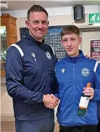  ?? Picture: Yate Town FC ?? Yate Town manager John Rendell presents Ben McLean with his man-ofthe-match award after the win against Gosport