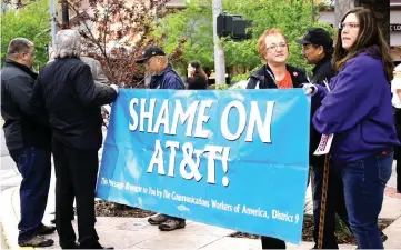  ??  ?? Members of Communicat­ions Workers of America protesting during AT&T’s annual meeting in Billings.