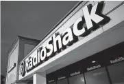  ?? Associated Press file photo ?? Radioshack’s owner is looking to line up a potential buyer for its portfolio companies, sources said.