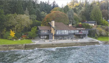  ?? PHOTOS: ROBERT BRITTINGHA­M ?? This stunning home on Vashon Island in Washington is accessible only by ferry or private boat. The boat house will accommodat­e a 60-foot boat.