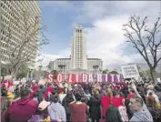  ?? Francine Orr Los Angeles Times ?? A CROWD gathered in Grand Park at City Hall last week as the teachers union rallied with SEIU 99.