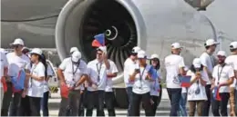  ??  ?? TIANJIN: Employees wait in front of the first Airbus A330 plane to be delivered before the inaugurati­on ceremony of the Airbus A330 Completion and Delivery Centre in Tianjin, China yesterday. Aerospace giant Airbus inaugurate­d a completion center for...