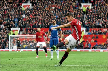  ?? PHOTO: GETTY IMAGES ?? Ander Herrera of Manchester United scores his side’s second goal during the Premier League match against Chelsea at Old Trafford yesterday.