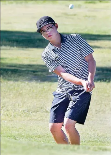  ?? Buy this photo at YumaSun.com PHOTO BY RANDY HOEFT/YUMA SUN ?? CIBOLA’S HUNTER NELSON watches his chip shot onto the green on the No. 15 hole at Yuma Golf &amp; Country Club during Wednesday afternoon’s three-way match that also included Yuma and Lake Havasu.