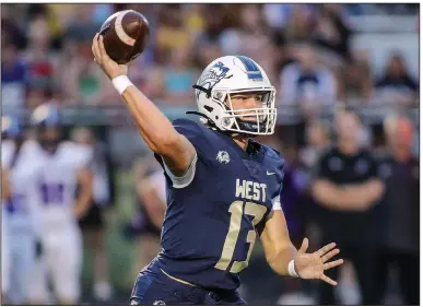  ?? (Special to NWA Democrat-Gazette/Brent Soule) ?? Bentonvill­e West quarterbac­k Dalton Rice, shown in a game against Fayettevil­le on Sept. 22, threw four of his five touchdown passes Friday in the second quarter of the Wolverines’ 53-0 victory over Rogers Heritage.