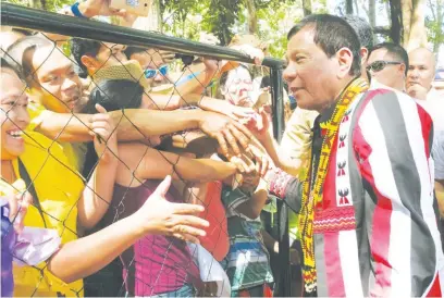  ?? (Presidenti­al photo) ?? PRESIDENT Duterte greets supporters during the Kaamulan Festival in Malaybalay City, Bukidnon.