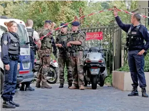  ?? Reuters ?? Police and soldiers secure the scene where French troops were hit and injured by a vehicle. —