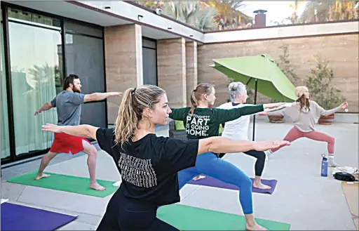  ?? PHOTOS BY ANDY AUSTIN / AUSTIN ADVENTURES ?? Dan Austin, his wife and their adult children recently reunited in Baja California, where group activities included a family yoga session.