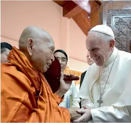  ?? — AFP ?? Pope Francis attends a meeting with Bhaddanta Kumarabhiv­asma, chairman of state Sanga Maha Nayaka Committee in Yangon on Wednesday.