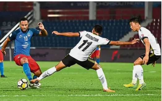  ??  ?? No impact: Johor Darul Ta’zim’s Harry Novillo (left) is one of the foreign imports who is in danger of being replaced.