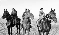  ??  ?? Afghan men riding horses in Mazar-i-Sharif.