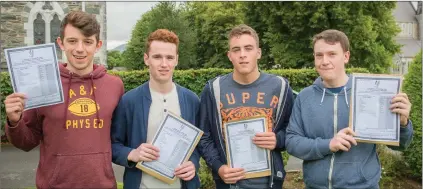  ??  ?? ABOVE: From left, Patrick Courtney, Cian Fleming, Brian Moynihan & Colum Forde receiving their Leaving Cert results from St Brendan’s College, Killarney. RIGHT: Brookfield College students Ellen Daly (Tralee) and Shane Riordan (Tralee) pictured after...