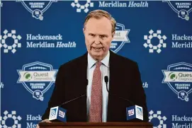  ?? John Minchillo/Associated Press ?? New York Giants president John Mara introduces new team general manager Joe Schoen during a news conference at the NFL team’s training facility on Jan. 26, 2022, in East Rutherford, N.J. Mara is fine with Schoen and coach Brian Daboll picking a quarterbac­k with the No. 6 pick in the NFL Draft in April.