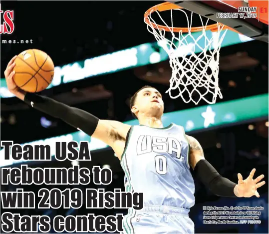  ?? AFP PHOTO ?? Kyle Kuzma (No. 0) of the US Team dunks during the 2019 Mountain Dew ICE Rising Stars at Spectrum Center on Saturday in Charlotte, North Carolina.