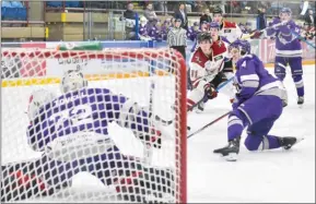  ?? ?? Tami Quan Photograph­y
Matthew Fusco of the West Kelowna Warriors tries to shovel a puck past Salmon Arm Silverback­s netminder Matthew Tovell in BC Hockey League action on Saturday.