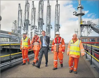  ??  ?? NEW CHAPTER: Jim Ratcliffe, CEO of Ineos, with staff at the Grangemout­h plant as the first ship carrying shale gas from the US was arriving in the Firth of Forth earlier this week. Picture: Jeff J Mitchell/Getty Images)