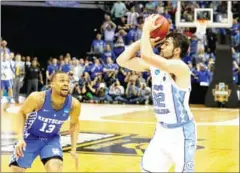  ?? KEVIN C COX/GETTY IMAGES/AFP ?? Luke Maye of the North Carolina Tar Heels shoots the game-winning basket against the Kentucky Wildcats with three-tenths of a second left in their 2017 NCAA Elite Eight game on Sunday.