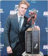  ?? JOHN LOCHER THE ASSOCIATED PRESS ?? Connor McDavid poses with the Ted Lindsay Award at theNHL awards Wednesday night in Las Vegas. The trophy goes to the player judged most outstandin­g in the regular season by members of the NHL Players’ Associatio­n.