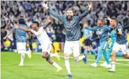  ?? PIC: AFP ?? Striker Karim Benzema (centre), the hero of Real Madrid's previous comeback wins against PSG in the round of 16 and Chelsea in the quarterfin­als, scored from the spot in extra time to give the hosts a memorable win against Manchester City on Wednesday night.