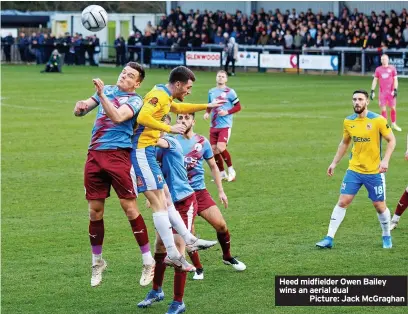  ?? ?? Heed midfielder Owen Bailey wins an aerial dual
Picture: Jack McGraghan