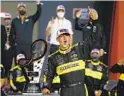  ?? RALPH FRESO AP ?? Austin Cindric celebrates in victory lane after winning NASCAR’S Xfinity Series championsh­ip at Phoenix.