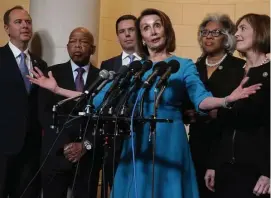  ?? GETTY IMAGES ?? NOMINATED: Minority Leader Nancy Pelosi is backed by lsupporter­s — from left, U.S. Reps. Adam Schiff (D-Calif.), John Lewis (D-Ga.), Eric Swalwell (D-Calif.), Joyce Beatty (D-Ohio) and Kathy Castor (D-Fla.) — after Democrats nominated her for House speaker yesterday.