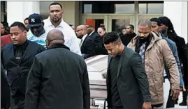  ?? ERIN HOOLEY/CHICAGO TRIBUNE PHOTOS ?? The casket of 26-year-old Jemel Roberson is carried out of the church after his funeral Saturday at House of Hope Worship Center in Chicago.