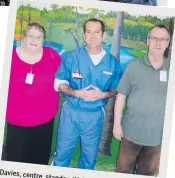  ?? THE CANADIAN PRESS ?? Davies, centre, stands with his parents during a visit in 2015.