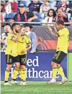  ?? BRIAN FLUHARTY/USA TODAY SPORTS ?? Crew forward Diego Rossi celebrates with midfielder Alexandru Măţan (20) and forward Cucho Hernández (9) after scoring a goal against the New England Revolution.