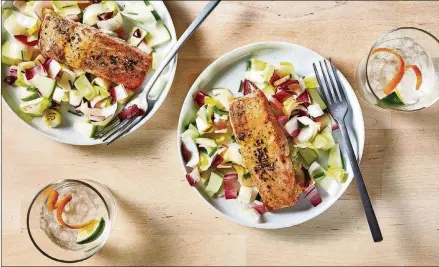  ?? GOLDBERG/ FOR THE WASHINGTON POST FOOD STYLING BY LISA CHERKASKY. STACY ZARIN ?? Honey Mustard Glazed Salmon With Endive and Green Apple Salad makes a light, high-protein dinner.