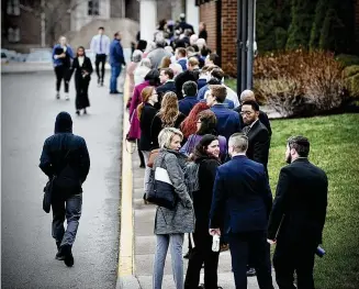  ?? MARSHALL GORBY / STAFF ?? Job seekers line up outside the Holiday Inn in Fairborn for the one-day Air Force Life Cycle Management Center hiring event Wednesday. AFLCMC is based at Wright-Patterson Air Force Base, home to some 35,000 military and civilian employees.