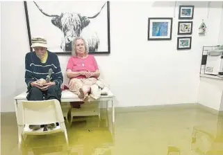  ?? JIM HAMMOND/COURTESY ?? Fort Lauderdale artist and puppeteer Jim Hammond rode out the storm in the flooded home of his mother-in-law, Glenore Bradshaw, 85, with his 98-year-old neighbor Scotty Packard.