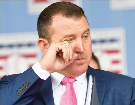  ?? HANS PENNINK/AP ?? Hall of Fame enshrinee Jim Thome wipes away a tear as his daughter sings the national anthem at the induction ceremony Sunday in Cooperstow­n, N.Y.