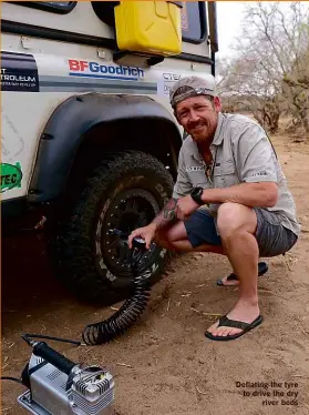  ??  ?? Deflating the tyre to drive the dry river beds