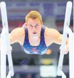  ?? AP ?? Sam Mikulak competes on the parallel bars during the men’s US Olympic Gymnastics Trials in St Louis, Missouri, on Saturday, June 26.