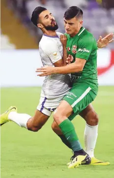  ?? Courtesy: AGL ?? Bandar Al Ahbabi (left) of Al Ain and Mauro Diaz of Shabab Ahli clash during an Arabian Gulf League match. Struggling Shabab Ahli take on promoted Kalba today.