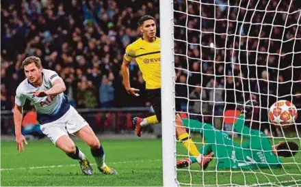  ?? AFP PIC ?? Tottenham’s Jan Vertonghen (left) celebrates after scoring their second goal against Dortmund in a Champions League round of 16 first leg match at Wembley Stadium on Wednesday.