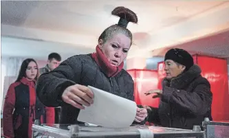  ?? THE ASSOCIATED PRESS ?? A woman casts her ballot at a polling station during rebel elections in Donetsk, Ukraine, Sunday.