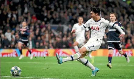  ?? AP ?? Son Heung-min scores his second goal in Tottenham’s 5-0 win over Red Star Belgrade yesterday.