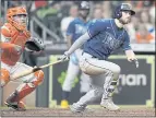  ?? DAVID J. PHILLIP — THE ASSOCIATED PRESS ?? The Rays’ Brandon Lowe watches his two-run home run along with Astros catcher Martin Maldonado during the sixth inning Thursday.