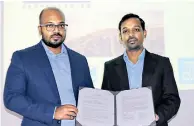  ??  ?? Pavithra Ishan Abeynayake, Managing Director (right) of Scan Technologi­es Global (Pvt) Ltd with Engineer, Raguparan Kobiraj (left) after signing the agreements
