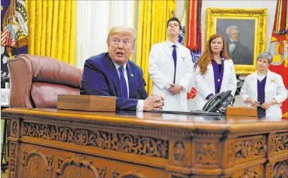  ?? Evan Vucci The Associated Press ?? President Donald Trump speaks during an Oval Office event Wednesday to sign a proclamati­on in honor of National Nurses Day.