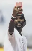  ??  ?? 0 Mo Farah takes a selfie at the London Stadium yesterday.