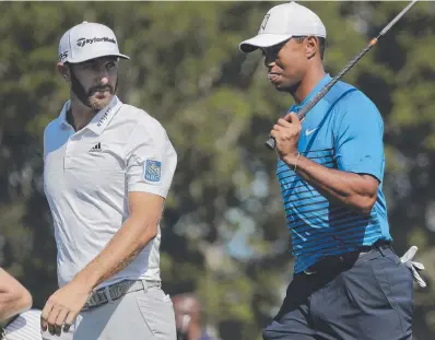  ?? Picture: JULIE JACOBSEN/AP ?? HE’S BACK: Tiger Woods walks with Dustin Johnson in a practice round for the US Open.
