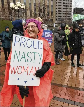  ?? SARAH FRANKS / STAFF ?? About 150 protesters braved the rain to gather at Courthouse Square in downtown Dayton on Saturday for the annual women’s march.